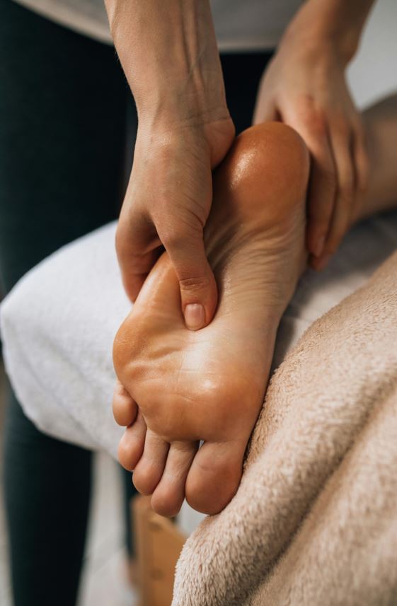 Photo of pressure point therapy in a clients foot at Durango Massage included with the price